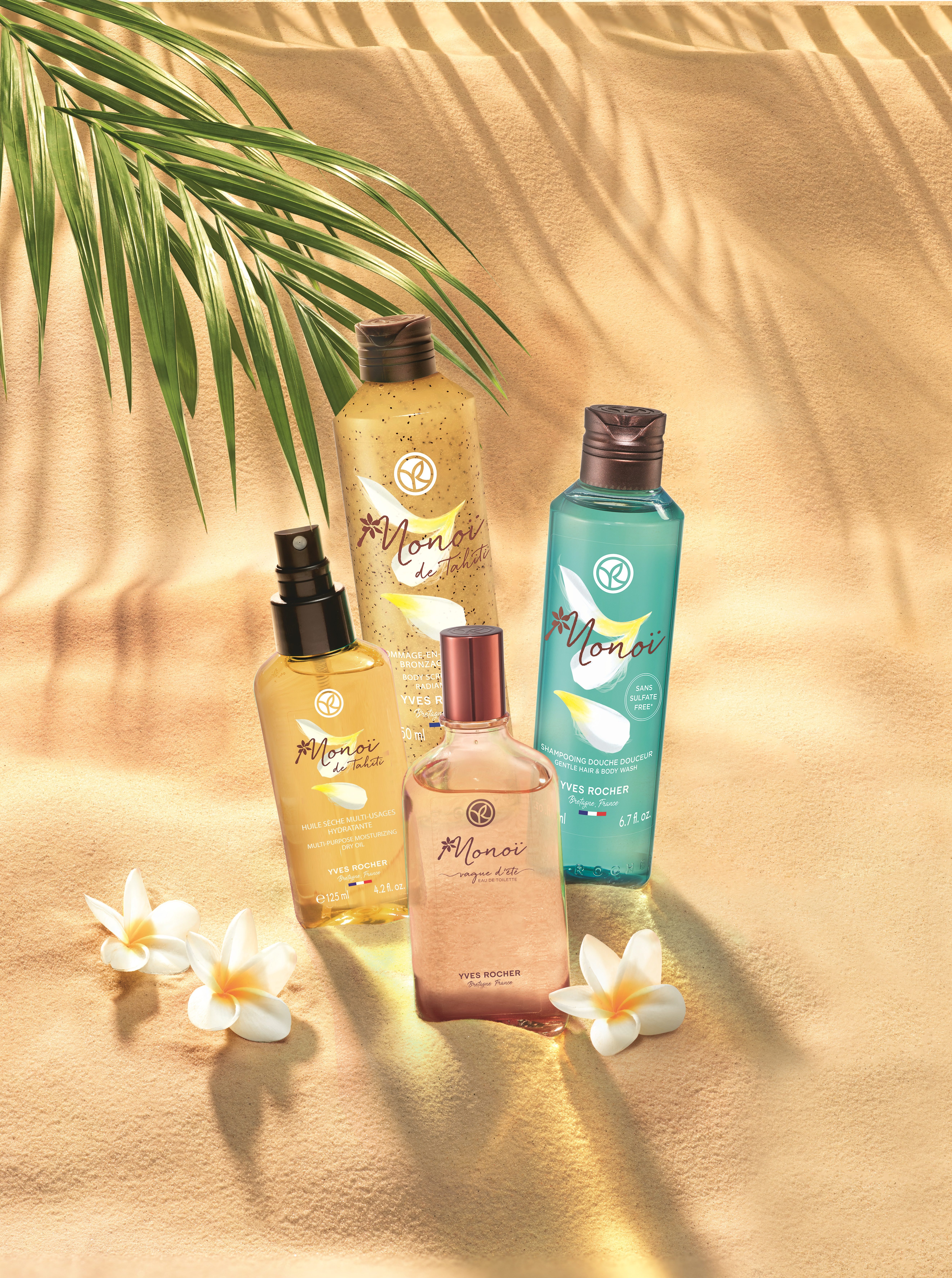 Monoi oil product line by Yves Rocher in the sand